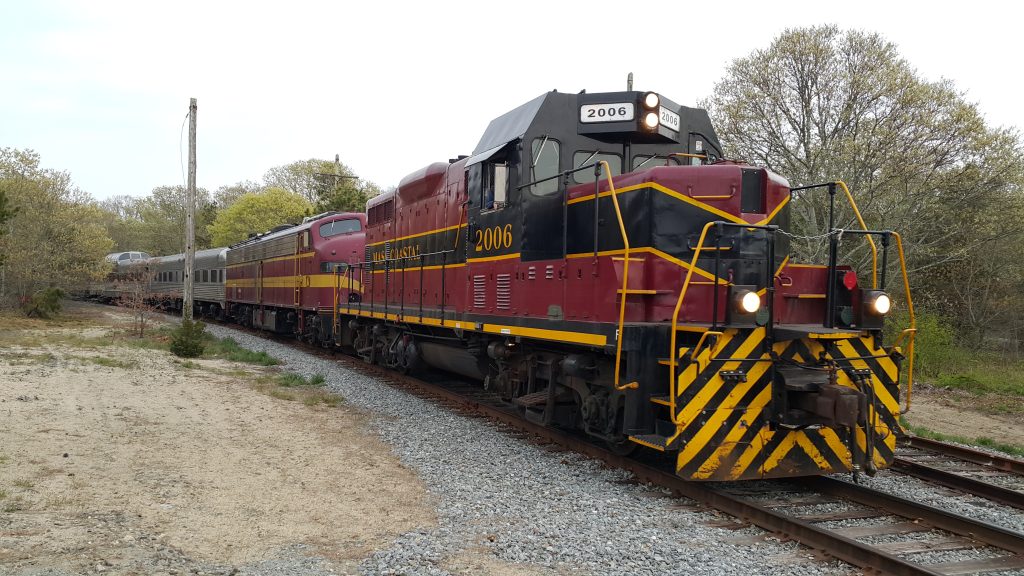 A passenger train barreling through Cape Cod.