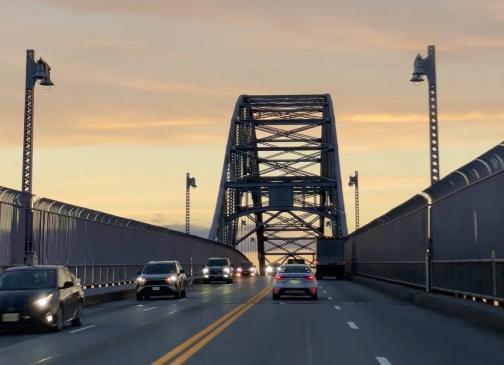 Cars driving across the Sagamore Bridge, which leads to Cape Cod.