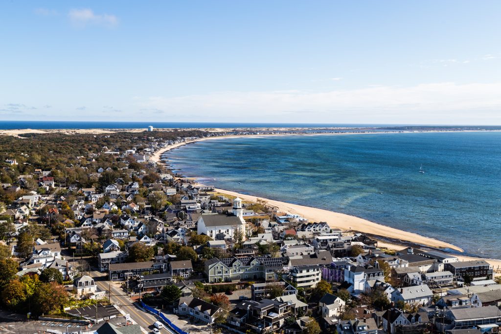 Aerial view of Provincetown with buildings, the beach, and the ocean