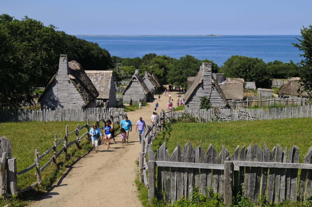 People walking down the path at the Plimouth Plantation, one of the best things to do in Plymouth MA